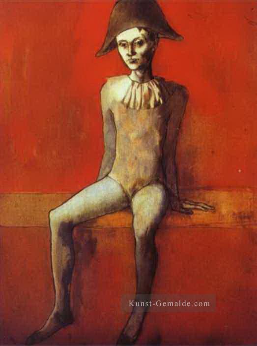 Harlekin sitzend auf einer roten Couch 1905 Pablo Picasso Ölgemälde